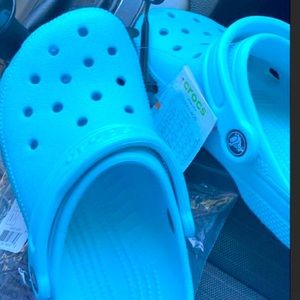 light blue vibrant crocs <3